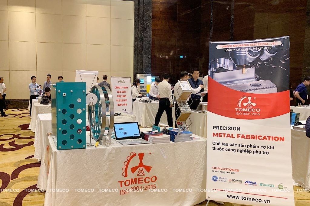 Table showing TOMECO's supporting industrial products at the event